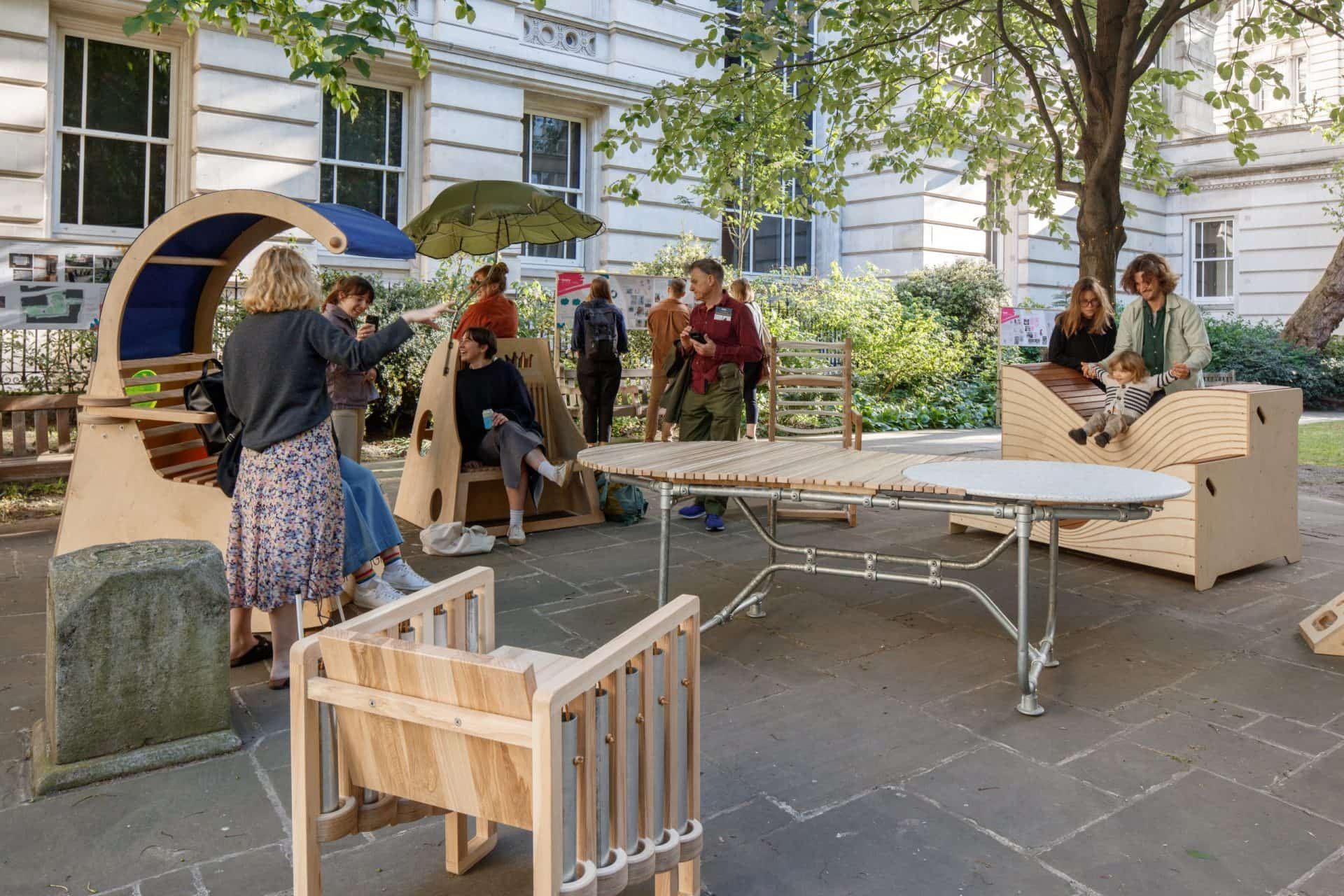 A seating arrangement of chairs of different shapes, sizes and materials