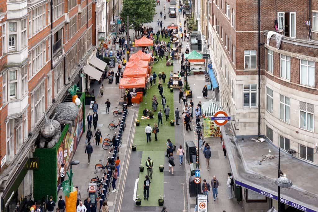 An aerial image of Warren Street, with gazebos and grass flooring 