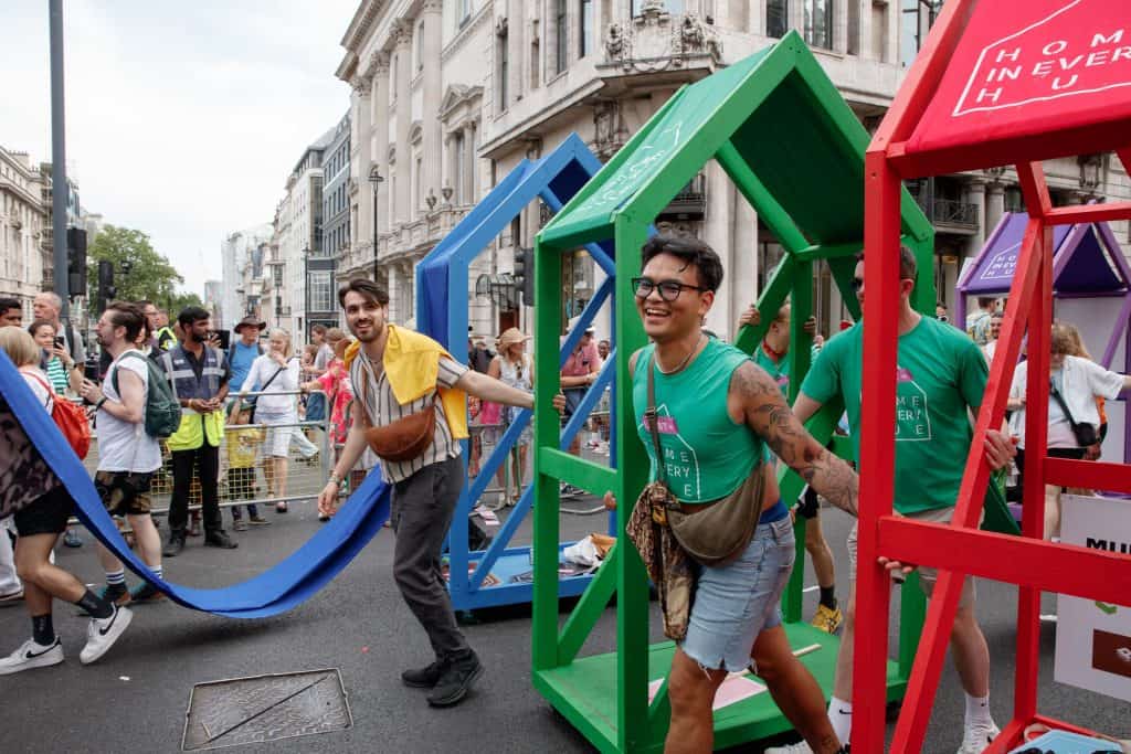 Two men pushing the structures during the parade.