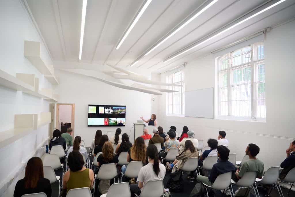 Image of students watching a presentation in a classroom.